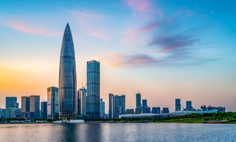 Shenzhen skyline at sunset with modern skyscrapers reflected in water